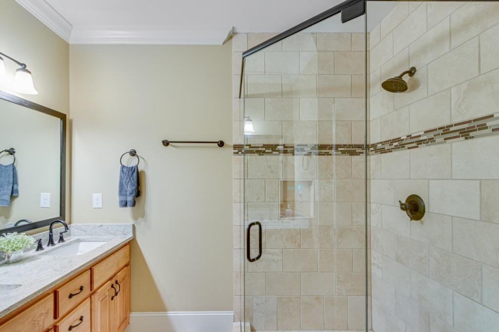 2152 Silver Circle Gainesville, GA 30501 - Photo 26 of 46 a bathroom with a granite countertop shower sink vanity and mirror