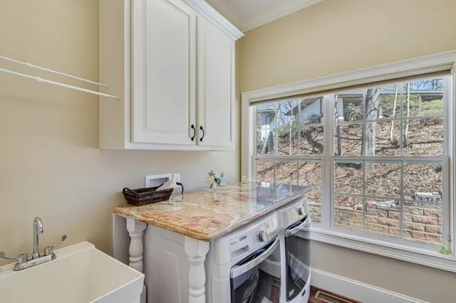 a view of a kitchen area with furniture and wooden floor