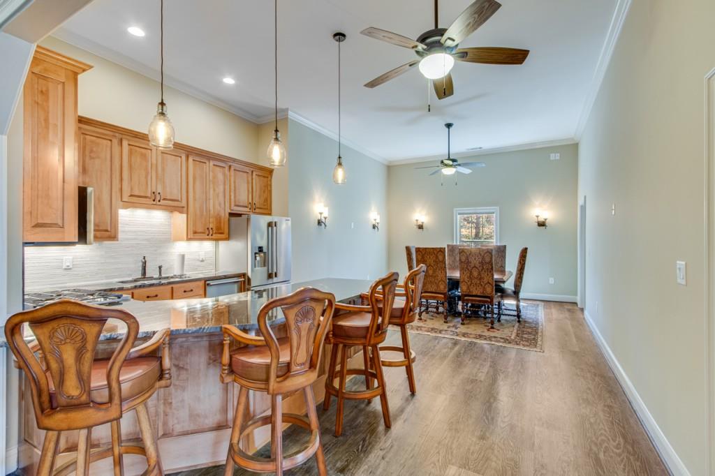 2152 Silver Circle Gainesville, GA 30501 - Photo 34 of 46 a very nice looking kitchen with furniture and a chandelier
