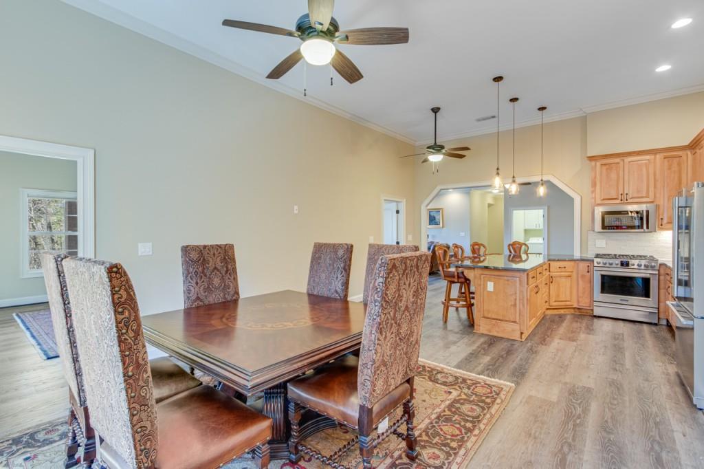 2152 Silver Circle Gainesville, GA 30501 - Photo 36 of 46 a living room with furniture kitchen view and a wooden floor
