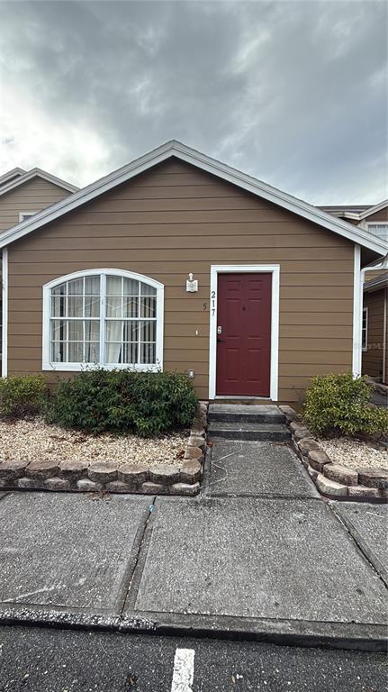 217 Australian Way, Unit 5 Davenport, FL 33897 - Photo 1 of 8 a front view of house and yard