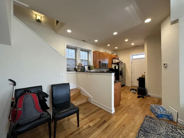 a view of kitchen with cabinets and wooden floor