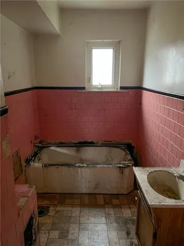 a bathroom with a sink and toilet