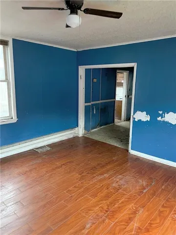 a view of a livingroom with wooden floor