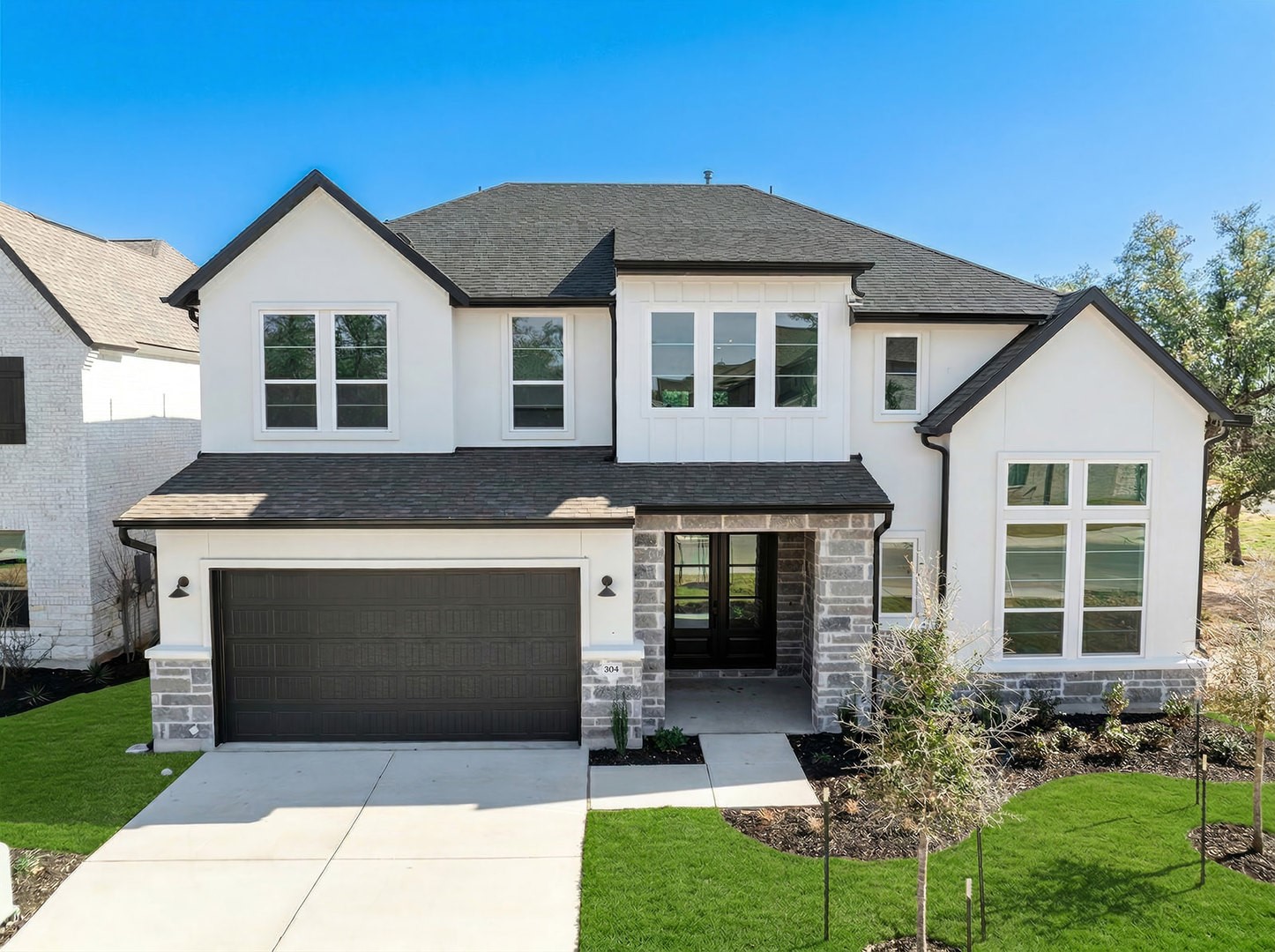 a front view of a house with a yard