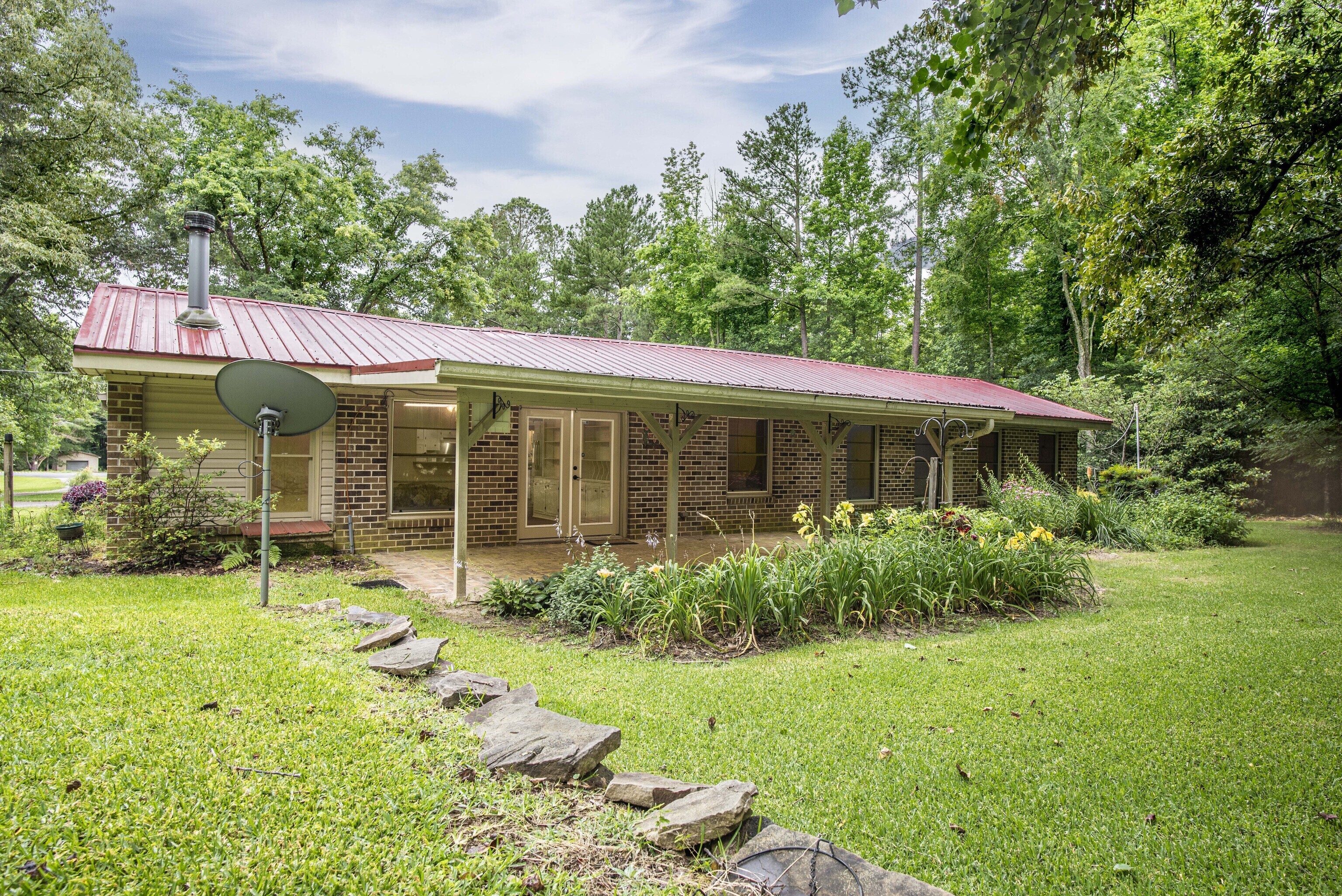 160 Atlanta Highway Rutledge, GA 30663 - Photo 1 of 1 a view of a house with garden and porch