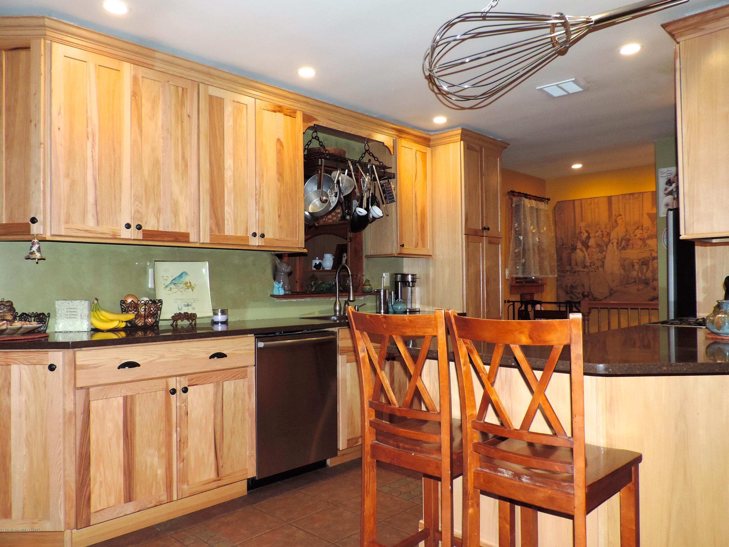 58 South Cooks Bridge Road Jackson, NJ 08527 - Photo 3 of 23 a kitchen with stainless steel appliances granite countertop a stove a sink and a microwave