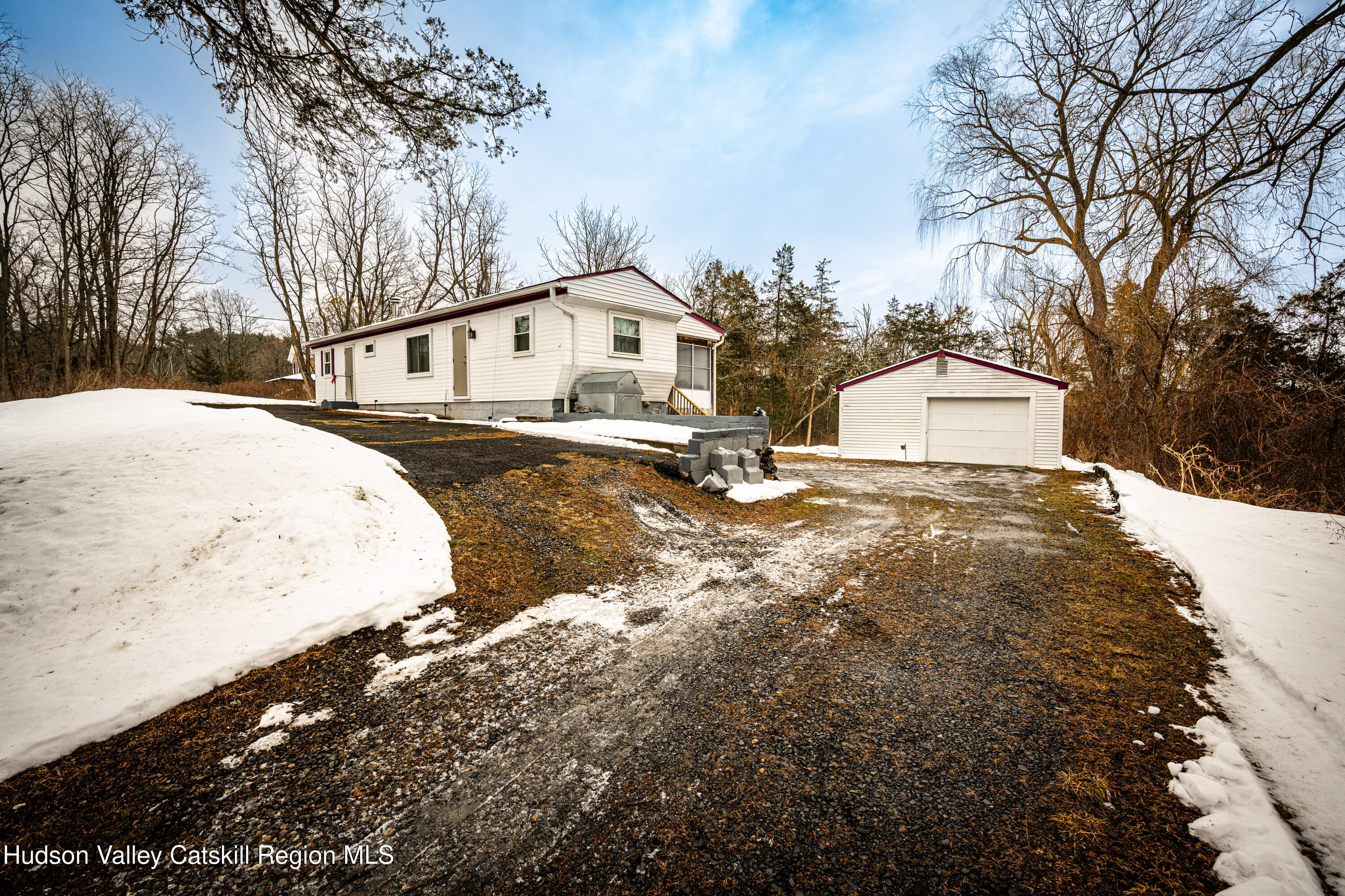 2860 Old Kings Road Catskill, NY 12414 - Photo 17 of 21 a view of a white house with a yard covered in snow