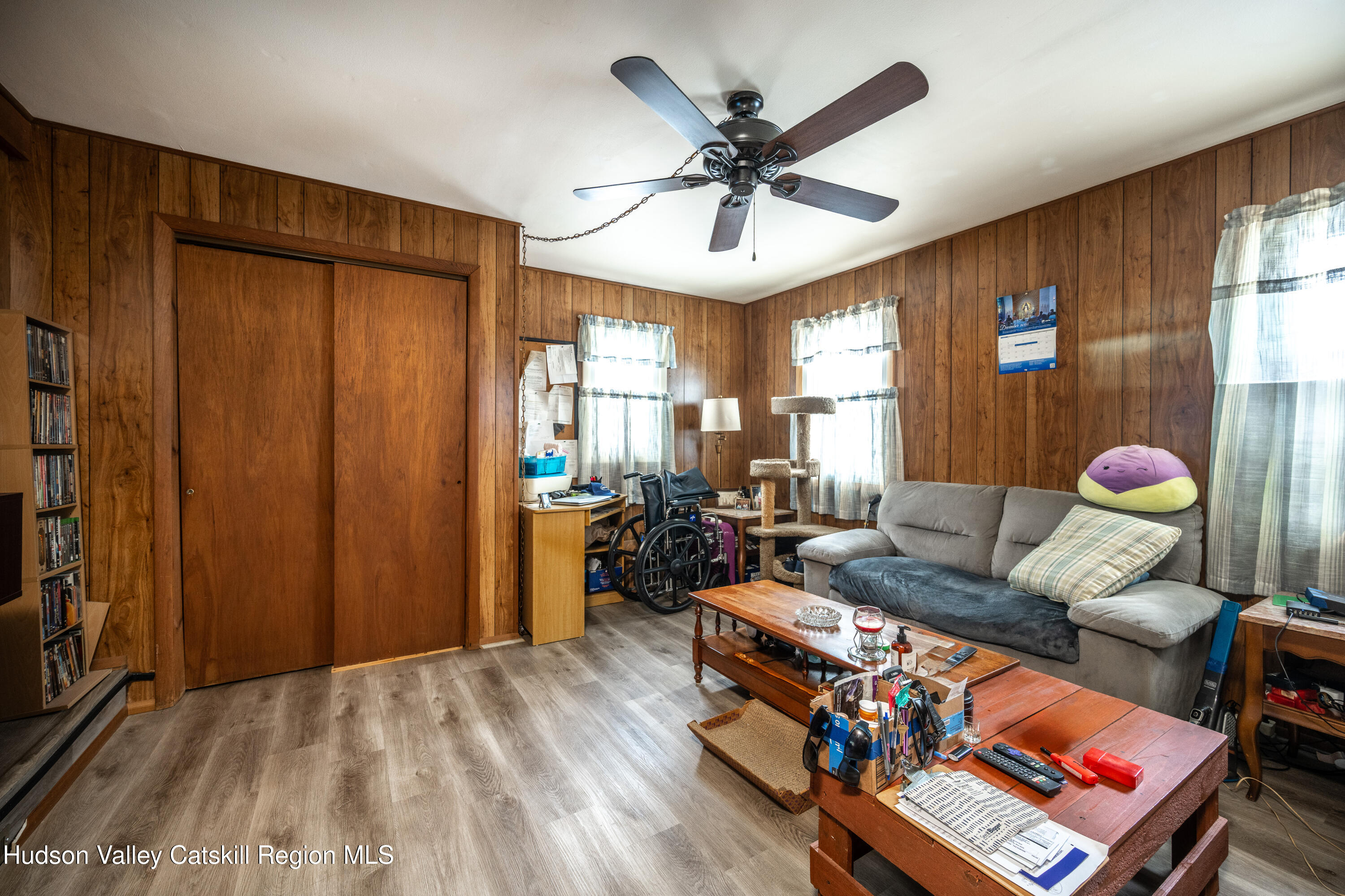 2860 Old Kings Road Catskill, NY 12414 - Photo 8 of 21 a living room with furniture a chandelier and a window