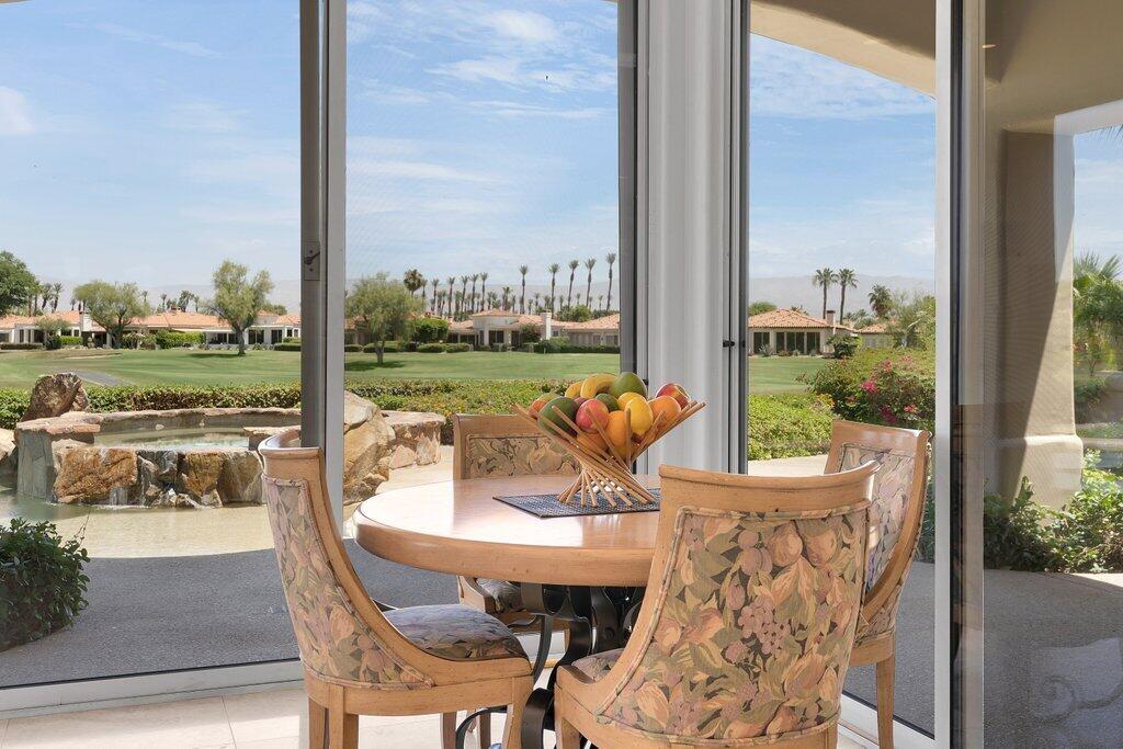 79860 Tangelo La Quinta, CA 92253 - Photo 14 of 45 a view of an outdoor dining room and a table