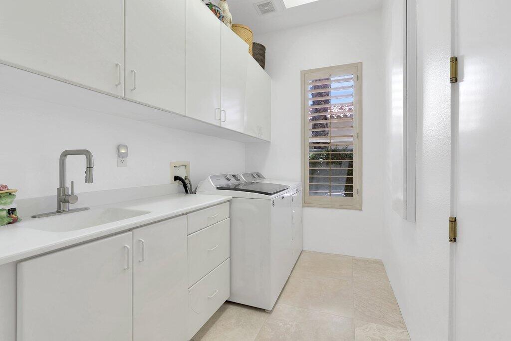79860 Tangelo La Quinta, CA 92253 - Photo 19 of 45 a kitchen with a sink and cabinets