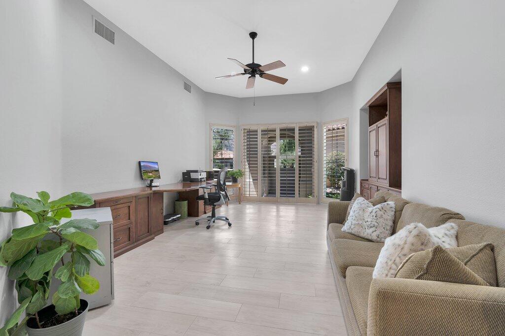 79860 Tangelo La Quinta, CA 92253 - Photo 20 of 45 a living room with furniture and a potted plant