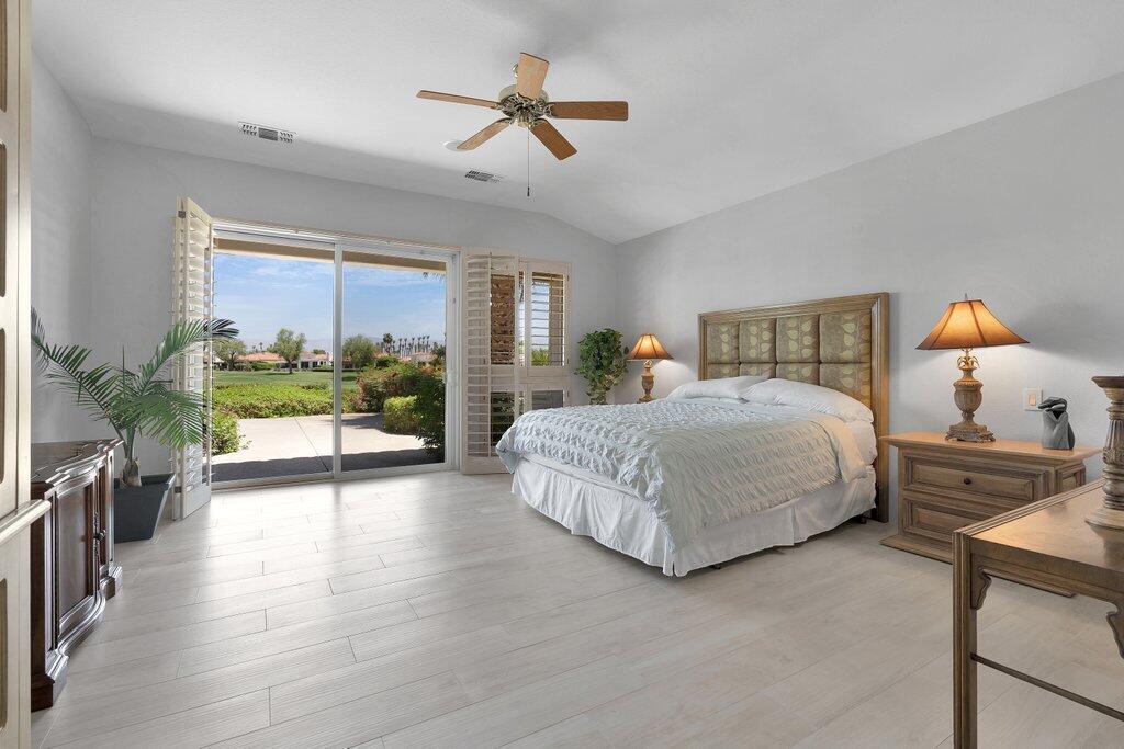 79860 Tangelo La Quinta, CA 92253 - Photo 22 of 45 a bedroom with a bed couch and a window