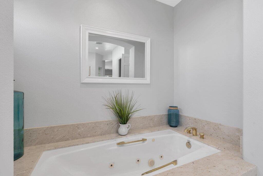 79860 Tangelo La Quinta, CA 92253 - Photo 26 of 45 a white bath tub sitting in a bathroom