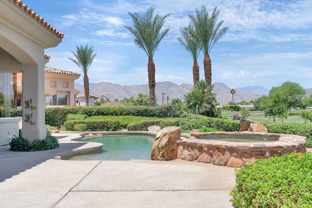 79860 Tangelo La Quinta, CA 92253 - Photo 29 of 45 a view of a lake with a palm trees