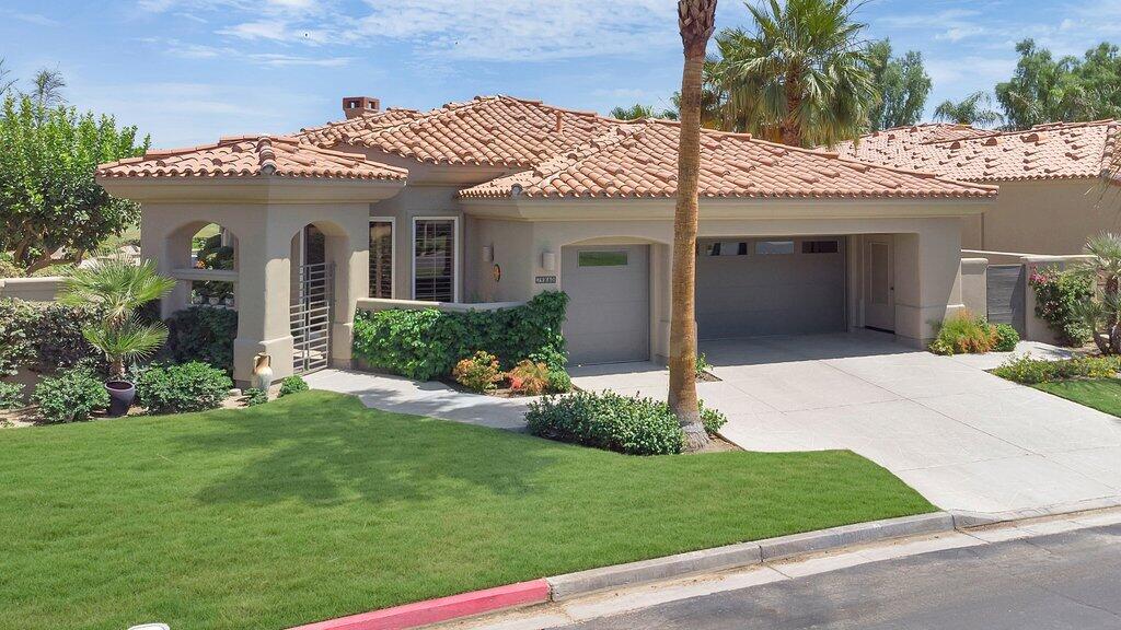 79860 Tangelo La Quinta, CA 92253 - Photo 35 of 45 a view of a house with a yard and potted plants