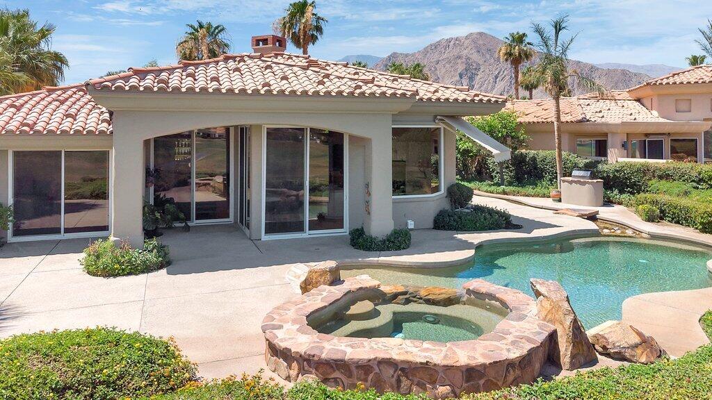 79860 Tangelo La Quinta, CA 92253 - Photo 36 of 45 a front view of a house with garden