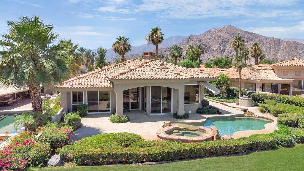 79860 Tangelo La Quinta, CA 92253 - Photo 4 of 45 a view of a house with swimming pool and garden