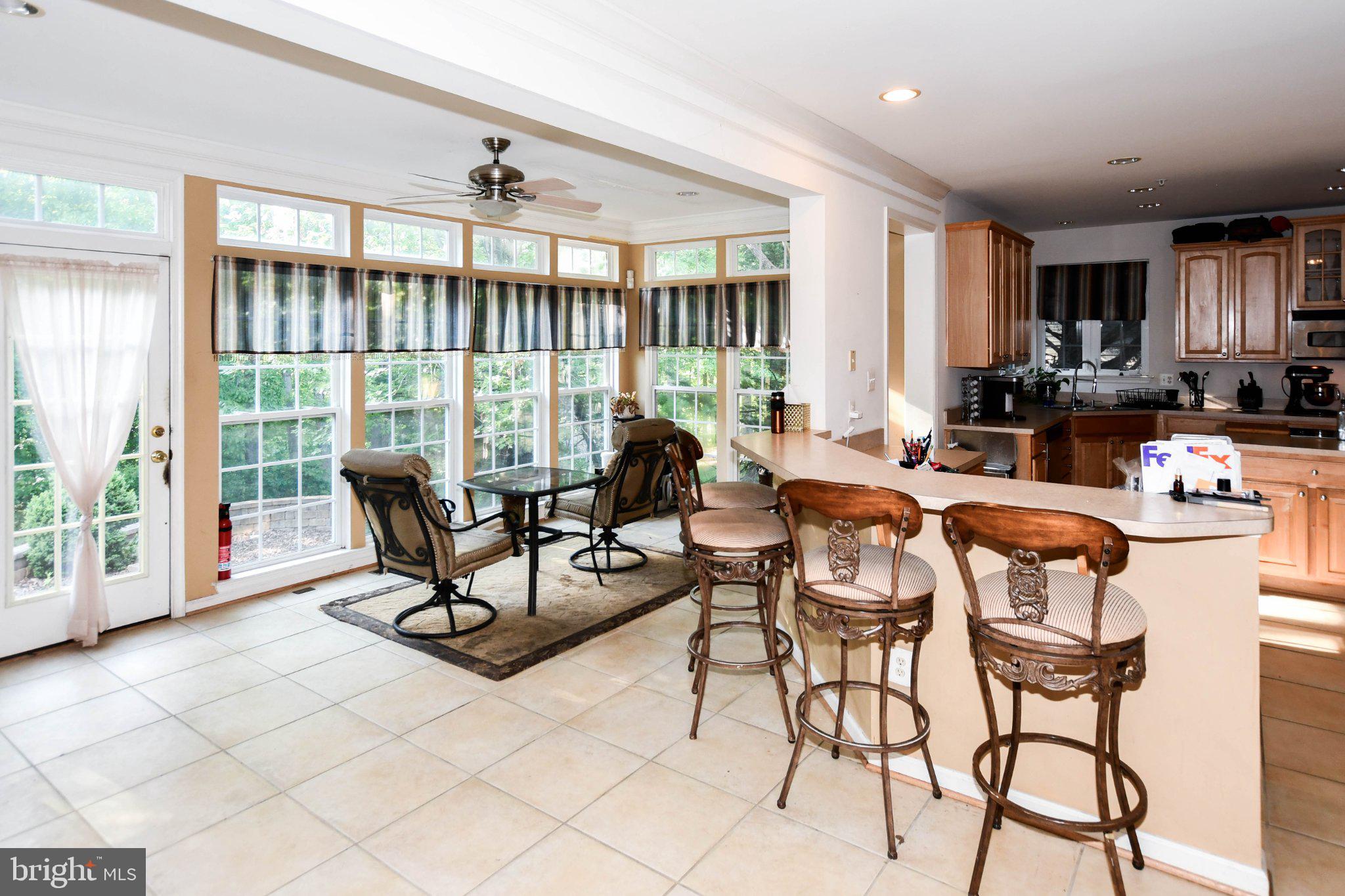 3208 Clavier Place Clinton, MD 20735 - Photo 15 of 55 a living room with furniture and floor to ceiling windows