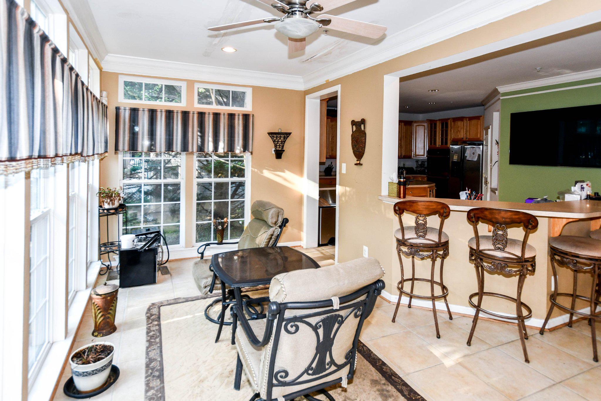 3208 Clavier Place Clinton, MD 20735 - Photo 16 of 55 a view of a dining room with furniture window and wooden floor