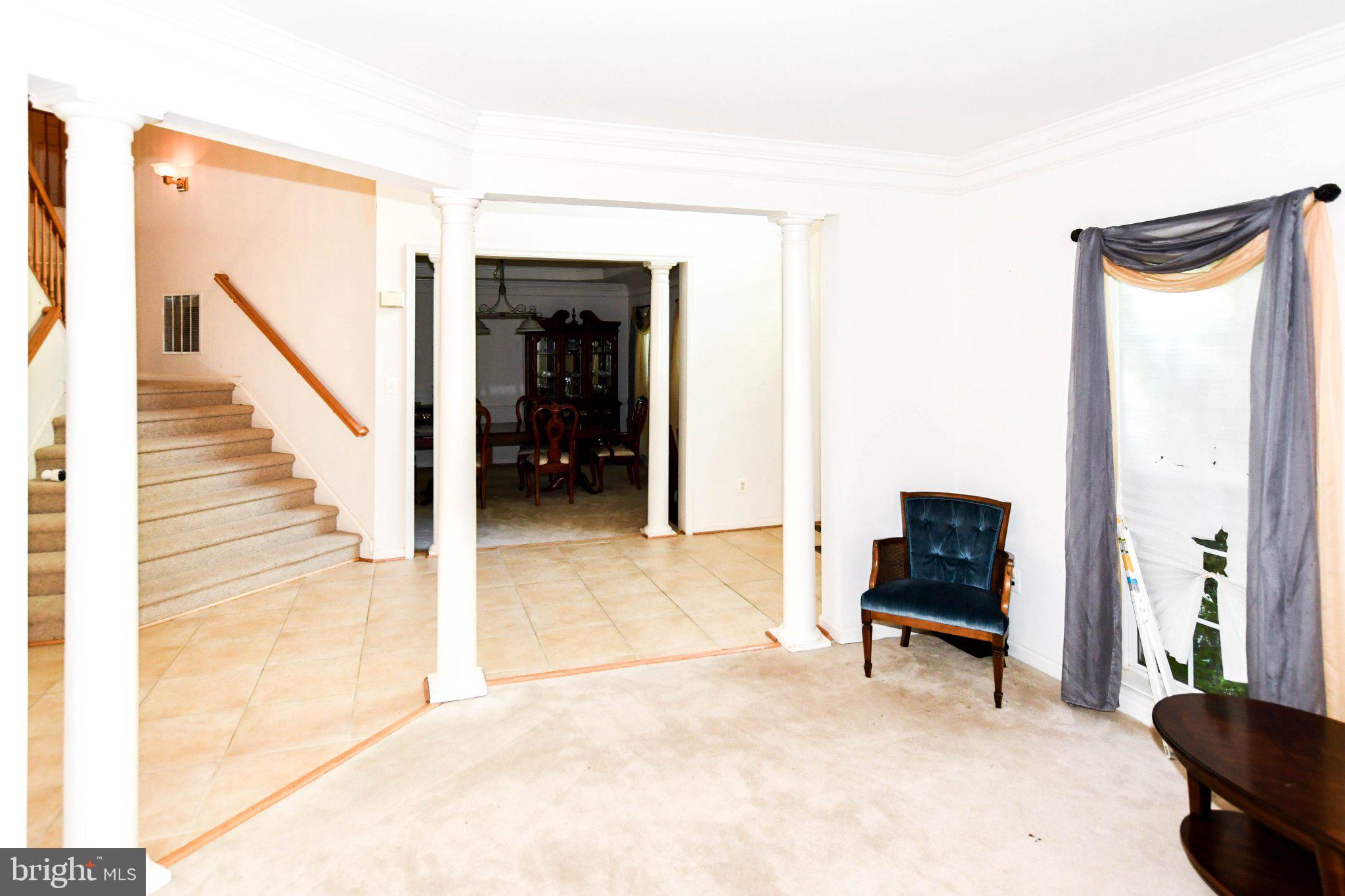 3208 Clavier Place Clinton, MD 20735 - Photo 4 of 55 a view of entryway and hall with a chair