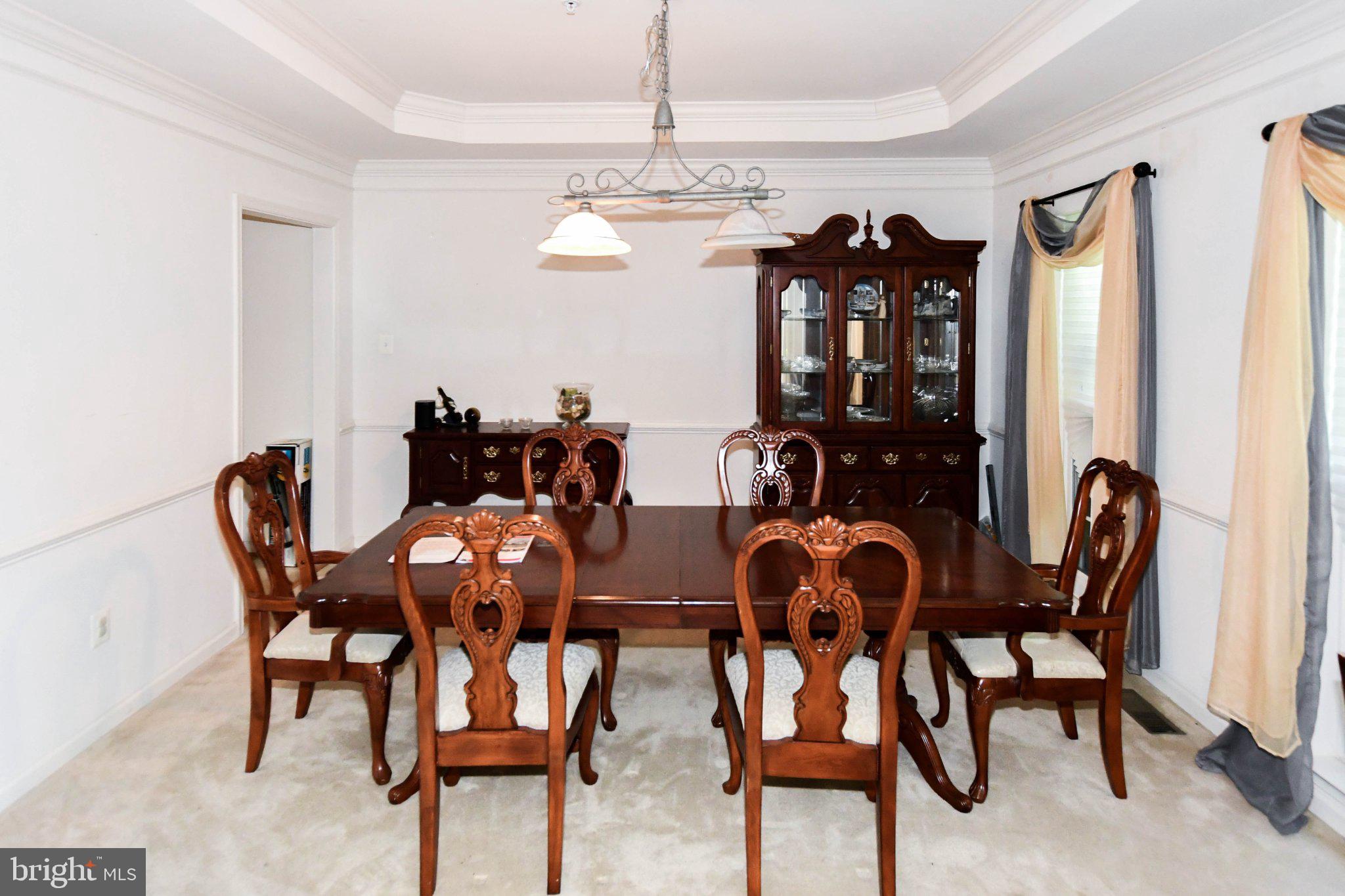 3208 Clavier Place Clinton, MD 20735 - Photo 6 of 55 a view of a dining room with furniture and chandelier