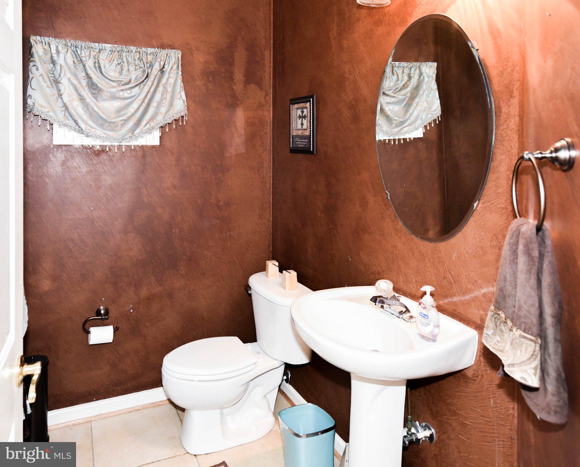 3208 Clavier Place Clinton, MD 20735 - Photo 9 of 55 a bathroom with a sink and a toilet