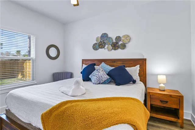 a bedroom with a bed and window