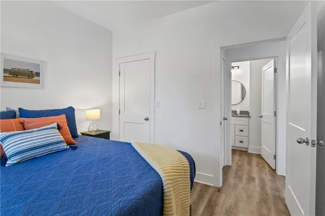 a bedroom with a bed and a table