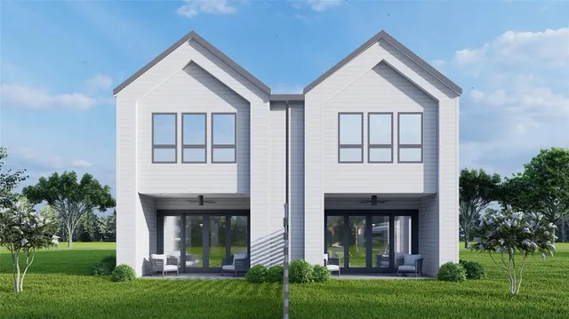 a view of house with yard and front view of a house