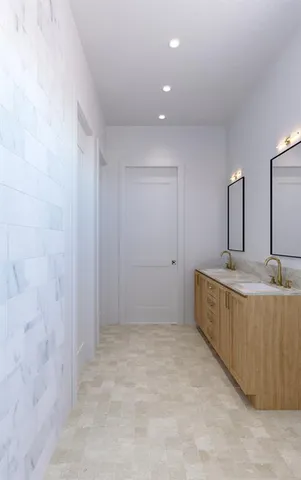 a bathroom with a granite countertop sink and mirror
