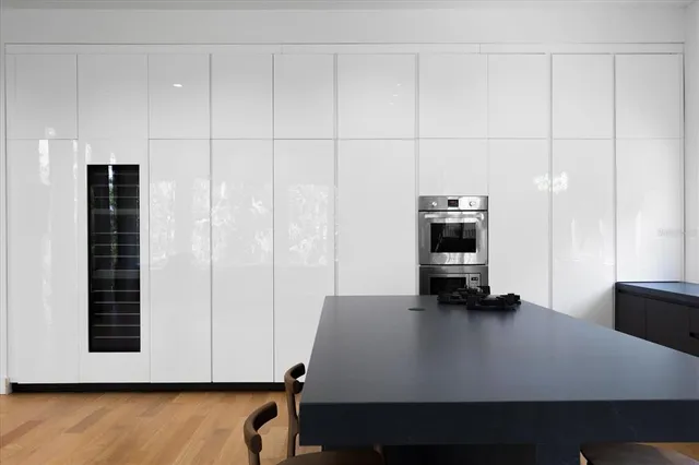 a view of kitchen with furniture and wooden floor