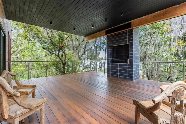 a view of a deck with wooden floor and outdoor space