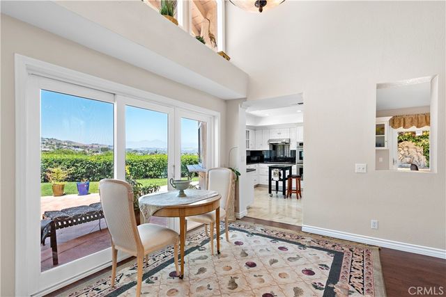 a spacious bathroom with a granite countertop sink a toilet a mirror and vanity