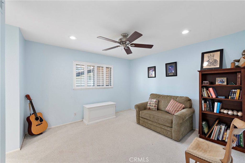 33622 Via Martos Dana Point, CA 92629 - Photo 32 of 46 a living room with furniture and a book shelf