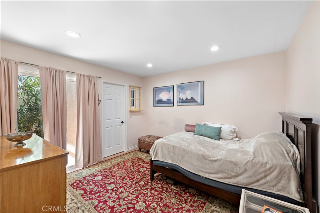 33622 Via Martos Dana Point, CA 92629 - Photo 34 of 46 a bedroom with a bed and wooden floor