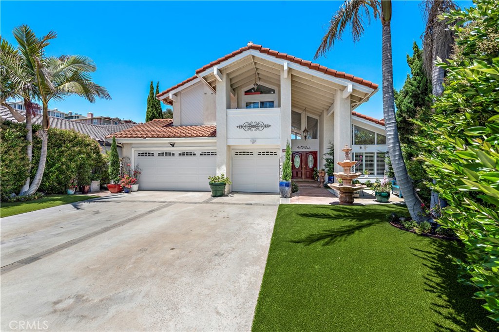 33622 Via Martos Dana Point, CA 92629 - Photo 36 of 46 a front view of a house with a yard and potted plants