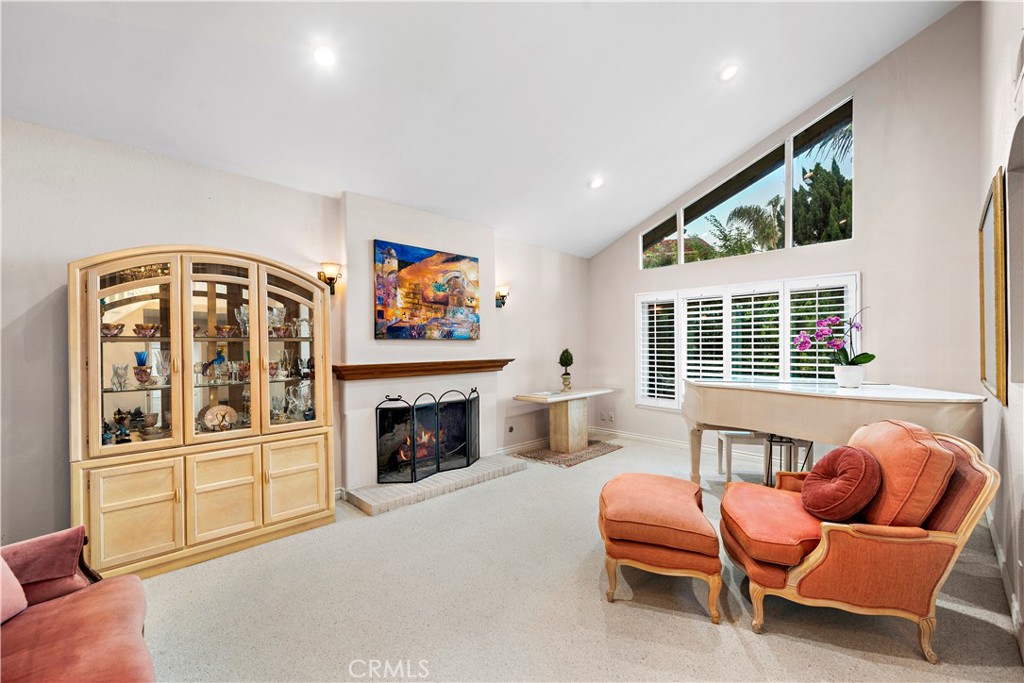 33622 Via Martos Dana Point, CA 92629 - Photo 7 of 46 a living room with furniture fireplace and window
