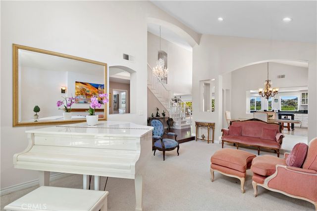 a dining room with furniture and a window