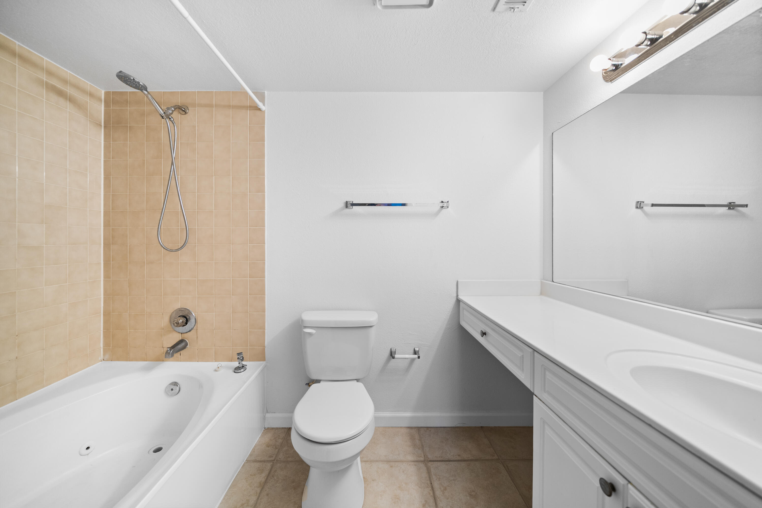 8237 Severn Drive, Unit A Boca Raton, FL 33433 - Photo 19 of 19 a bathroom with a sink a toilet and bathtub