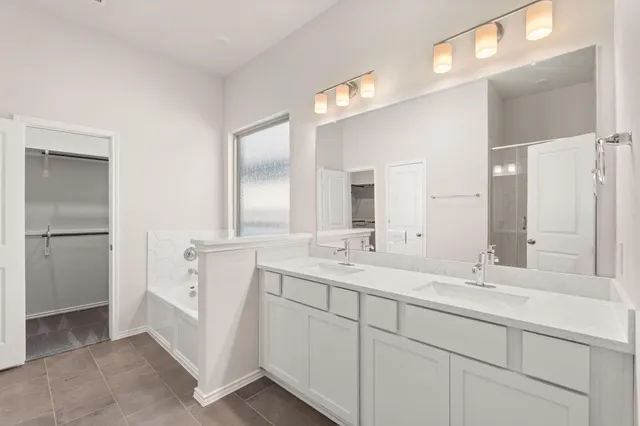 a bathroom with a bathtub and a shower