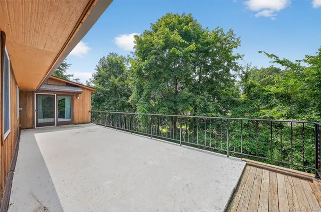 a backyard of a house with wooden floor
