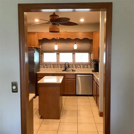 a room with a window and cabinets