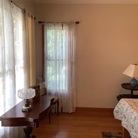 a room with a window and cabinets