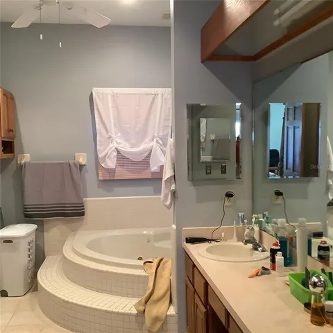 a view of walk in closet with clothes