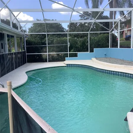 front view of a house with potted plants