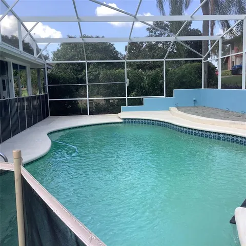 front view of a house with potted plants