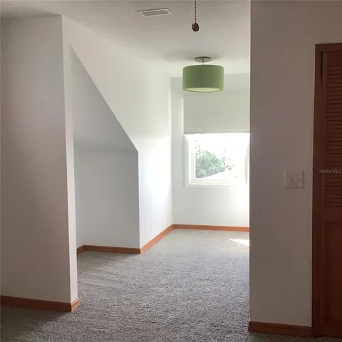 a kitchen with a sink cabinets and window