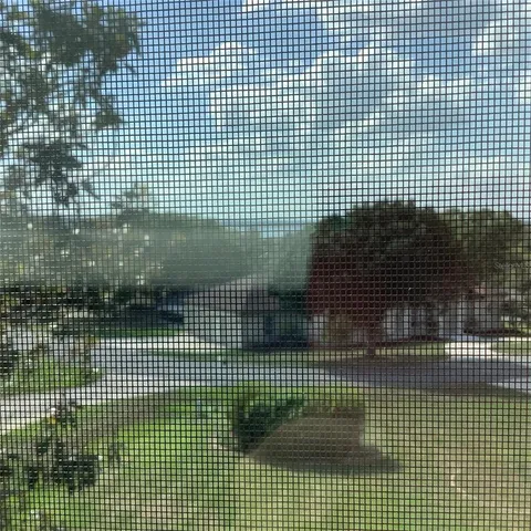 a view of a house with a backyard and a patio