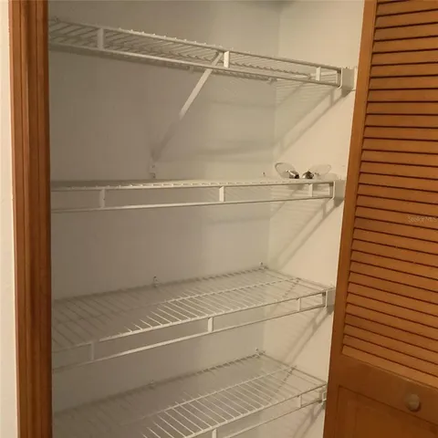 a view of a brick house with a large window